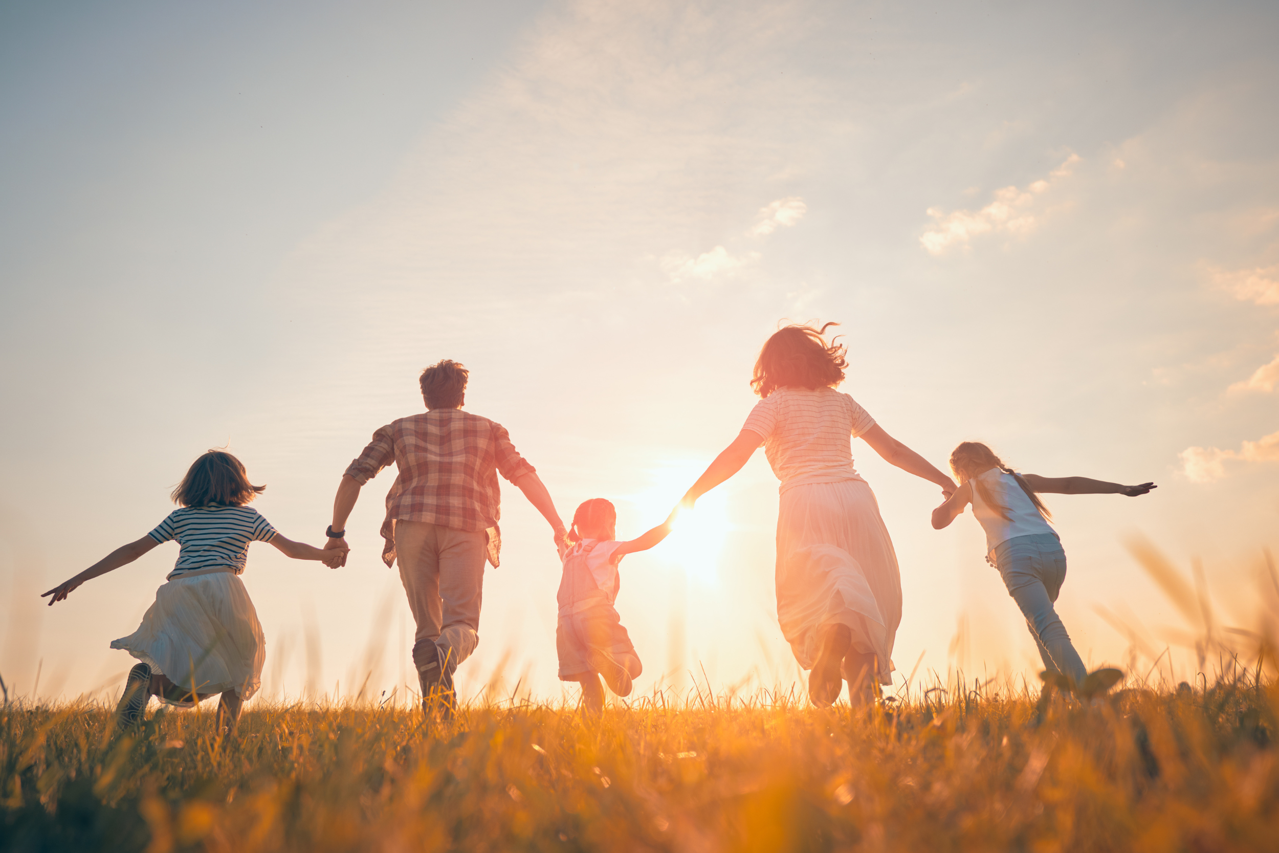 Family, holding hands, running, outside, sunset